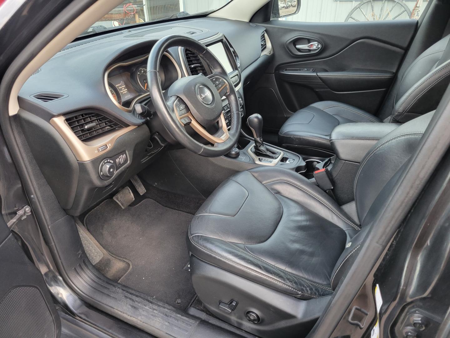 2015 Black /Black Jeep Cherokee Limited (1C4PJMDS4FW) with an 3.2L V6 engine, Automatic transmission, located at 450 N Russell, Missoula, MT, 59801, (406) 543-6600, 46.874496, -114.017433 - Nice Jeep. Lots of Features. 4 Wheel Drive. Automatic. Huge Sunroof. Leather Heated Seats. Power Drivers Seat. Heated Steering Wheel. Bluetooth. Steering Wheel Controls. Air. Cruise. Tilt. Power Windows and Locks. Towing. - Photo#13